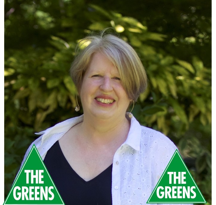 Beth Warren - profile photo with greens logo